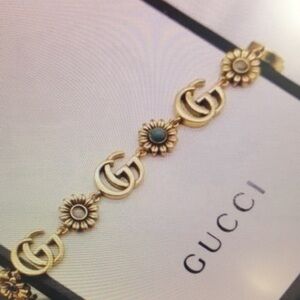 Gucci Gold-Tone Daisy Link Bracelet with Turquoise Accents